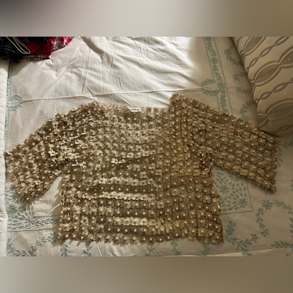 This pearl top is super fancy brand Rivir it’s so unique